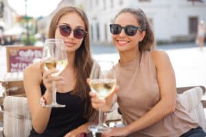 Friends enjoying the new signature Chardonnay from Halleck Vineyard.
